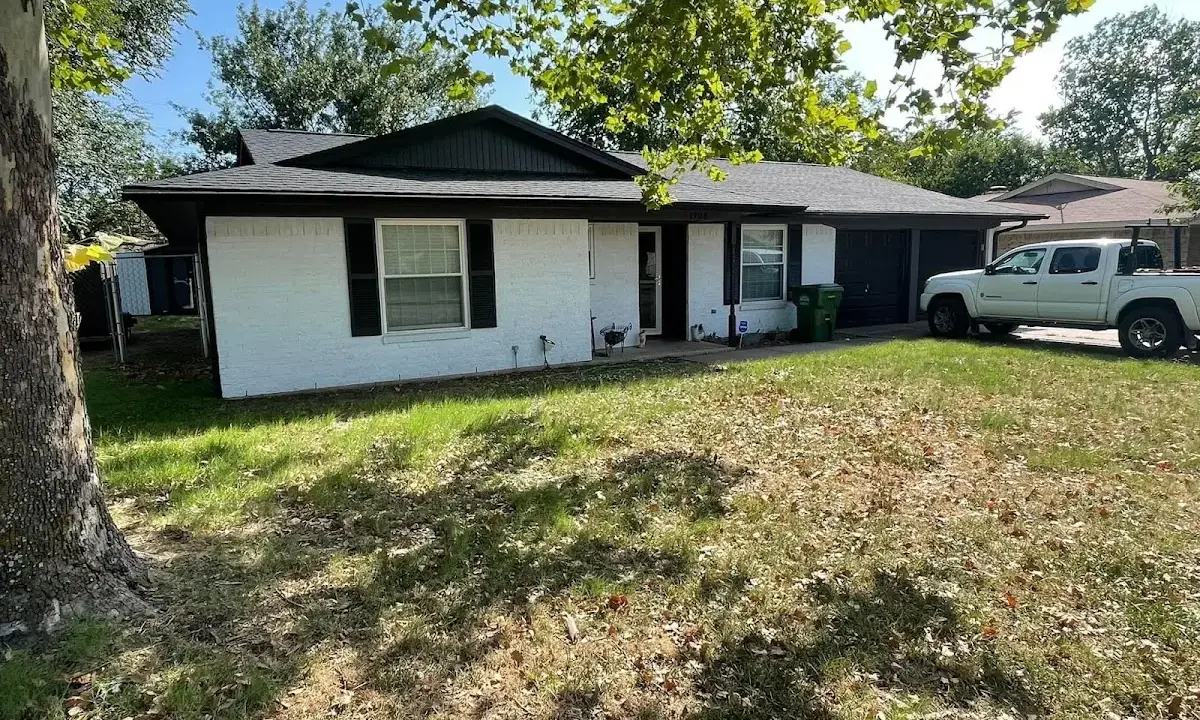 Professional roofing crew working on a residential roof in North Merritt Island